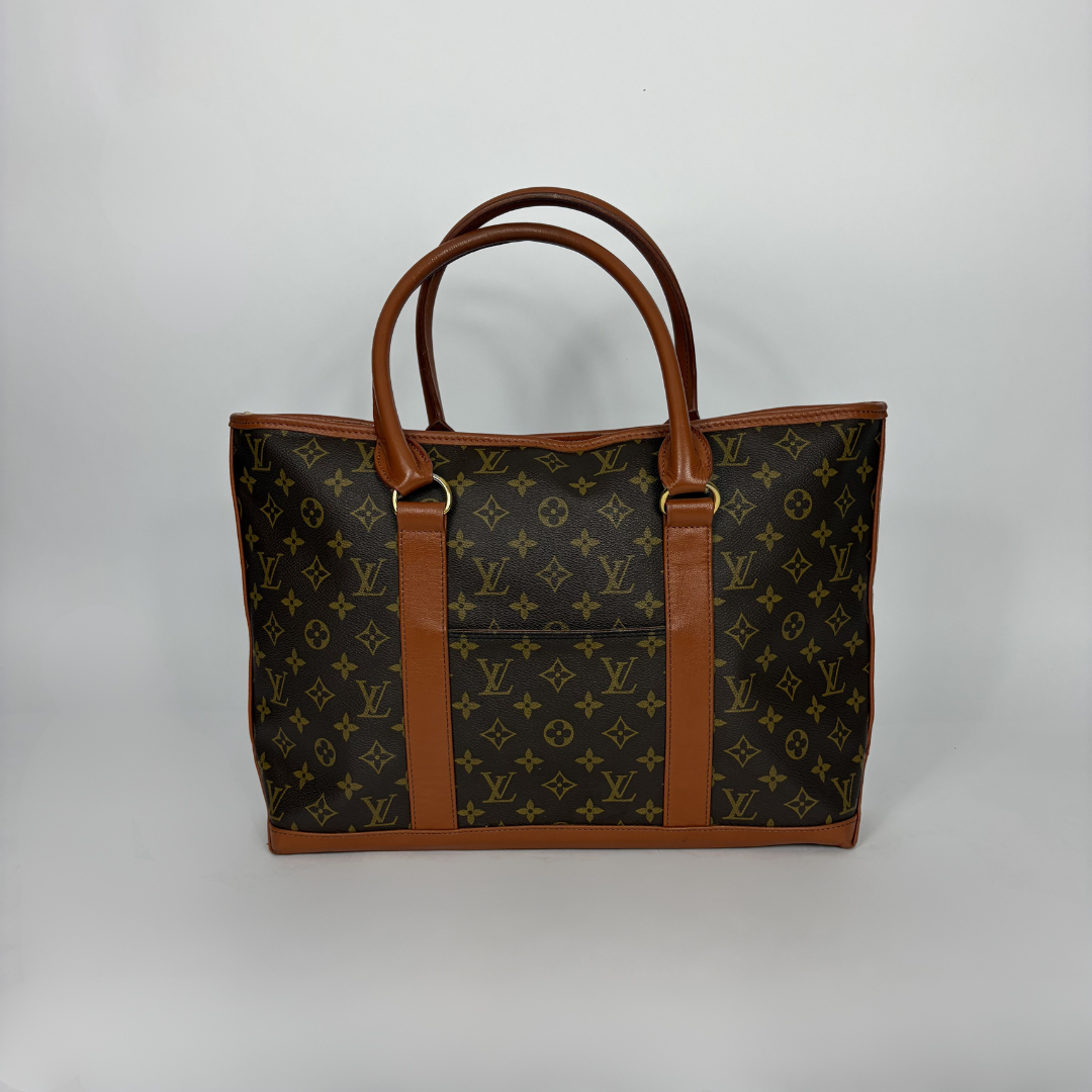 Louis Vuitton Sac Weekend PM Monogram Canvas on a white background