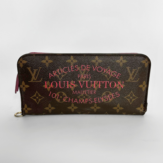 Louis Vuitton lompakko, jossa monogrammikuvio ja vaaleanpunainen teksti valkoisella taustalla