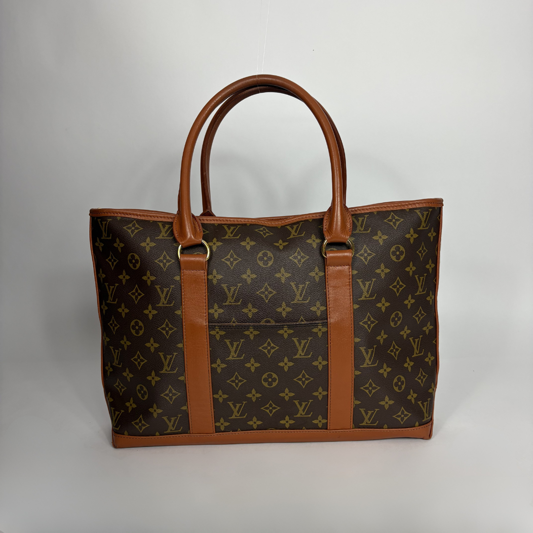 Louis Vuitton Sac Weekend PM Monogram Canvas on a white background