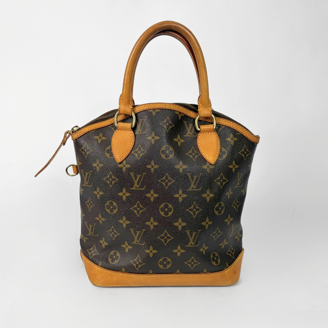 Designer handbag with monogram pattern on a white background