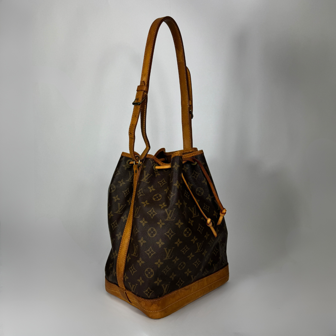 Louis Vuitton Petit Noe Monogram Canvas on a white background