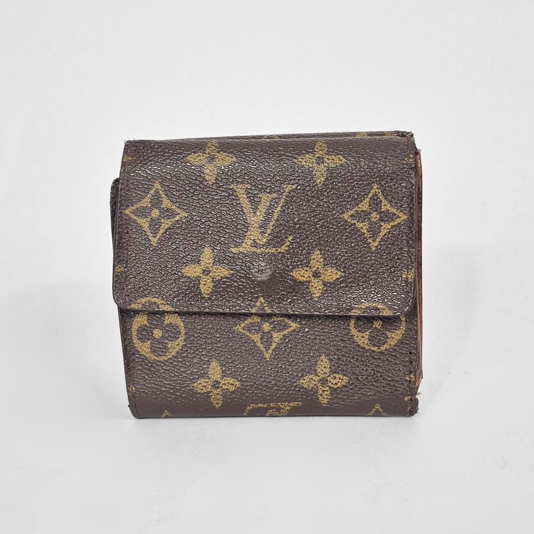 Louis Vuitton wallet with monogram pattern on a white background