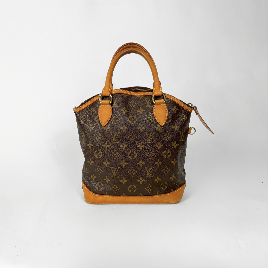 Brown handbag with monogram pattern on a white background