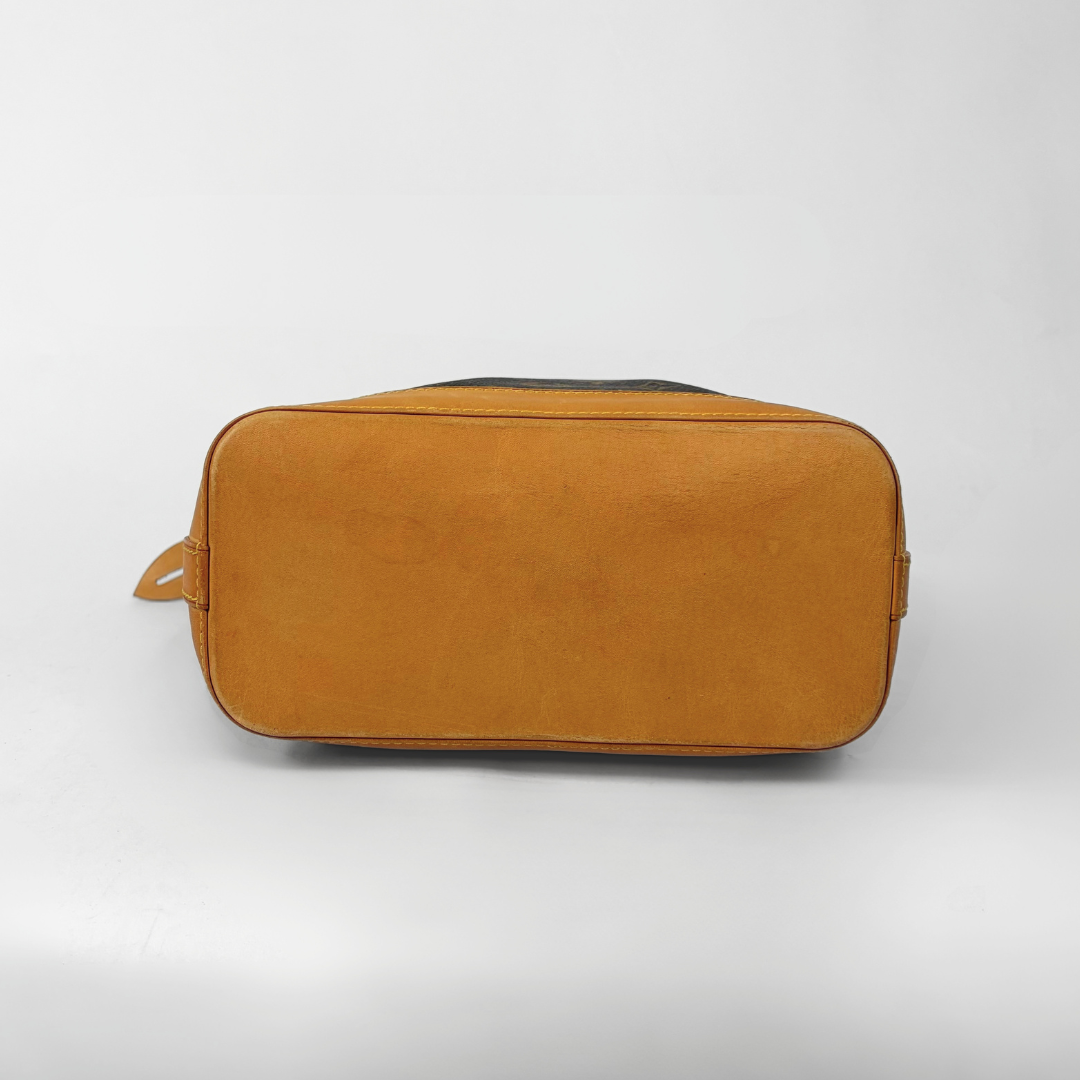 Brown duffel bag with monogram pattern on a white background