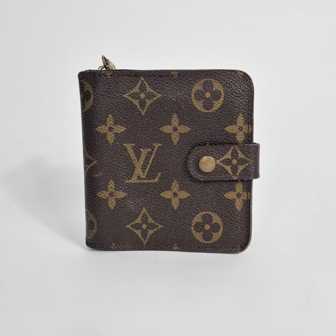 Louis Vuitton lompakko, jossa monogrammikuvio vaaleanharmaalla pohjalla