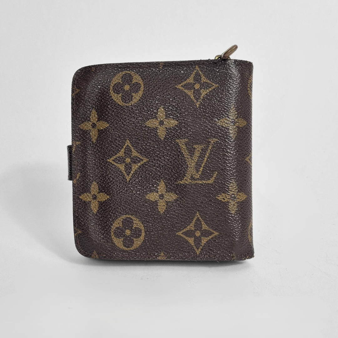Louis Vuitton lompakko, jossa monogrammikuvio vaaleanharmaalla pohjalla