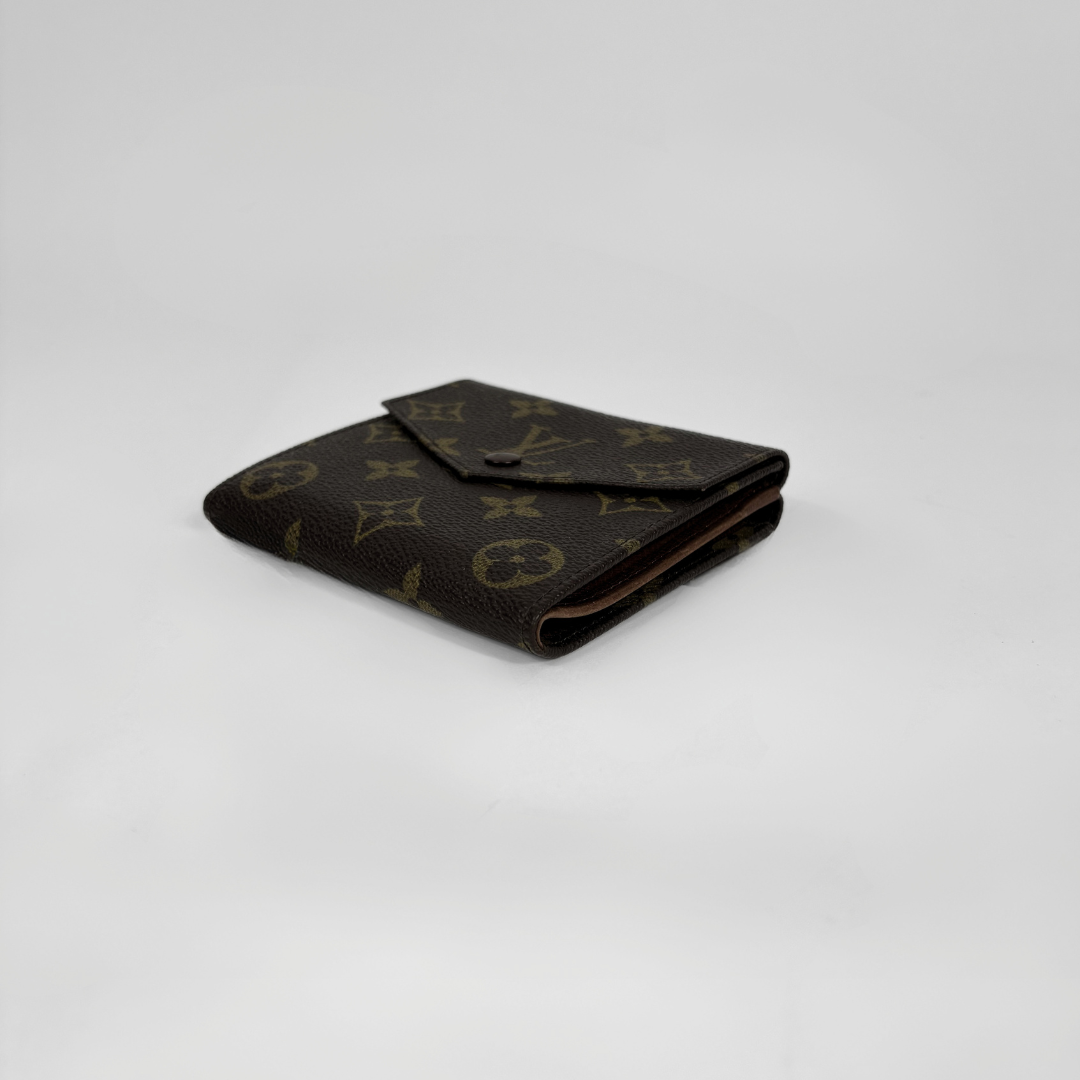 Louis Vuitton Druk Wallet on white background