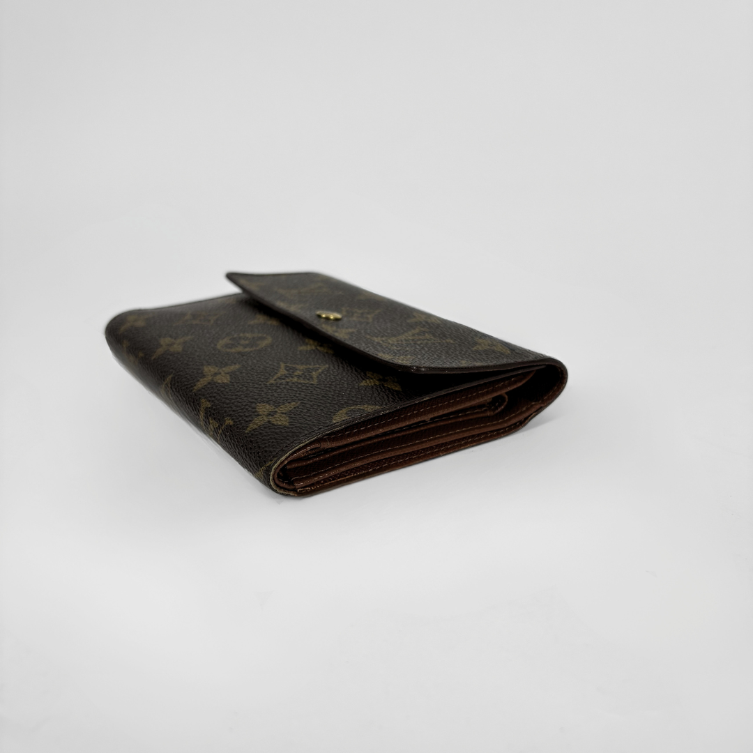 Louis Vuitton International Wallet Medium on a white background