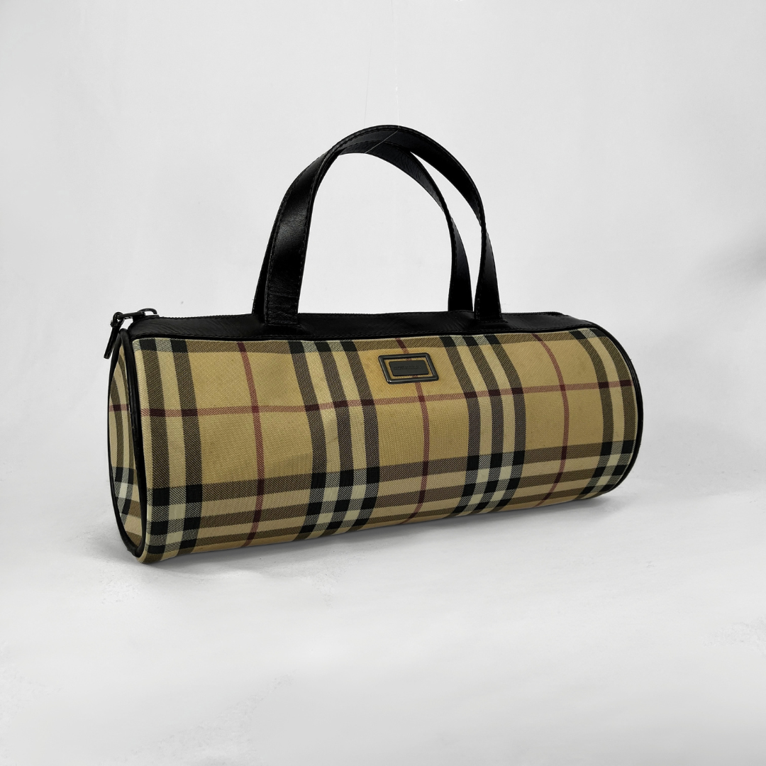 Burberry Mini Barrel handbag in the iconic beige House Check canvas with brown leather trims and details, displayed on a light grey background.
