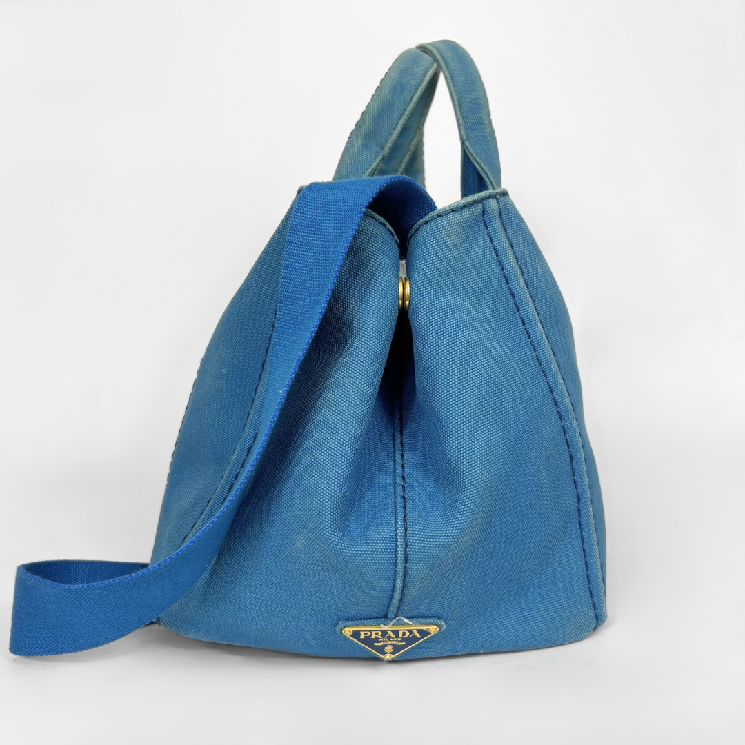 Blue Prada handbag on a white background
