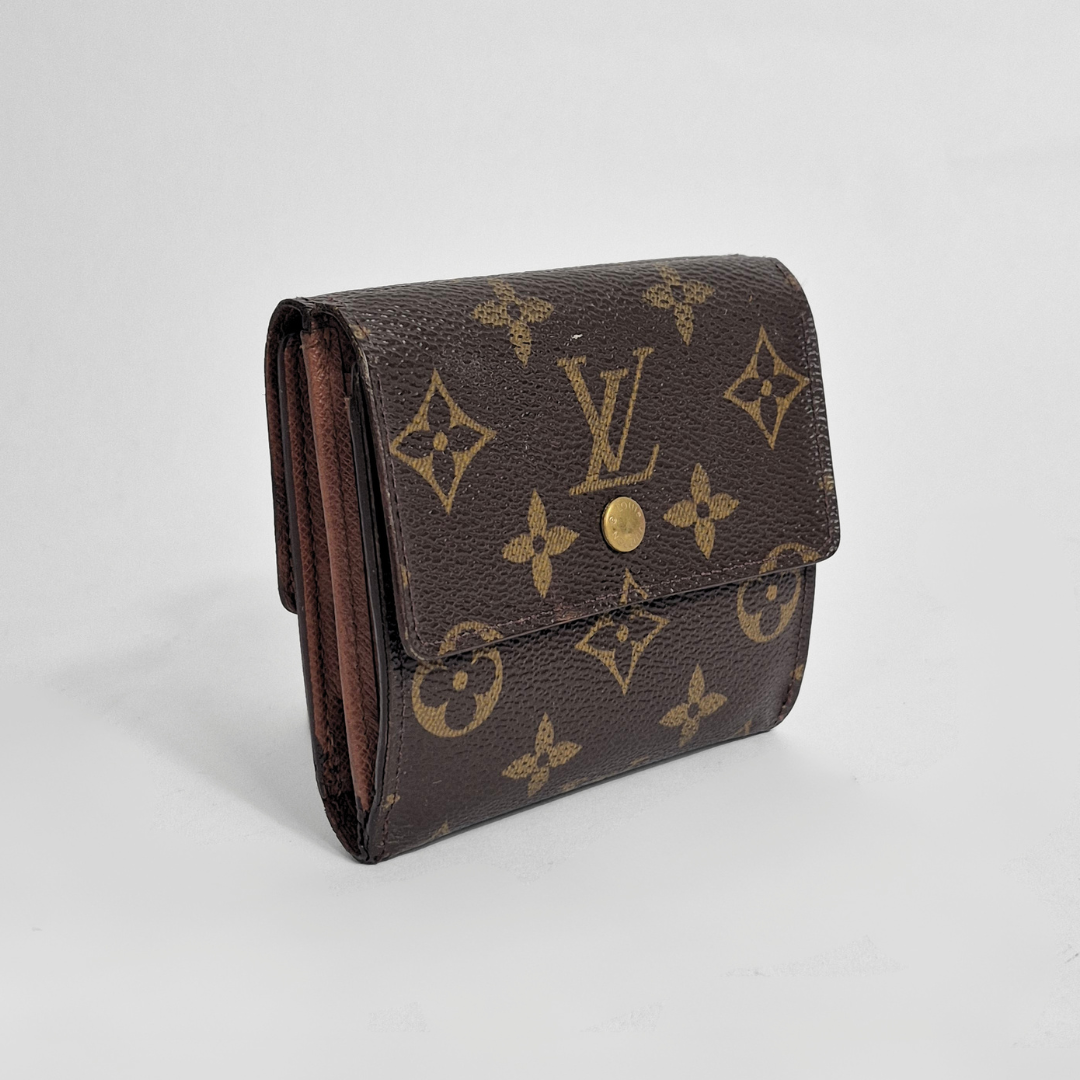 Louis Vuitton wallet with monogram pattern on a light gray background