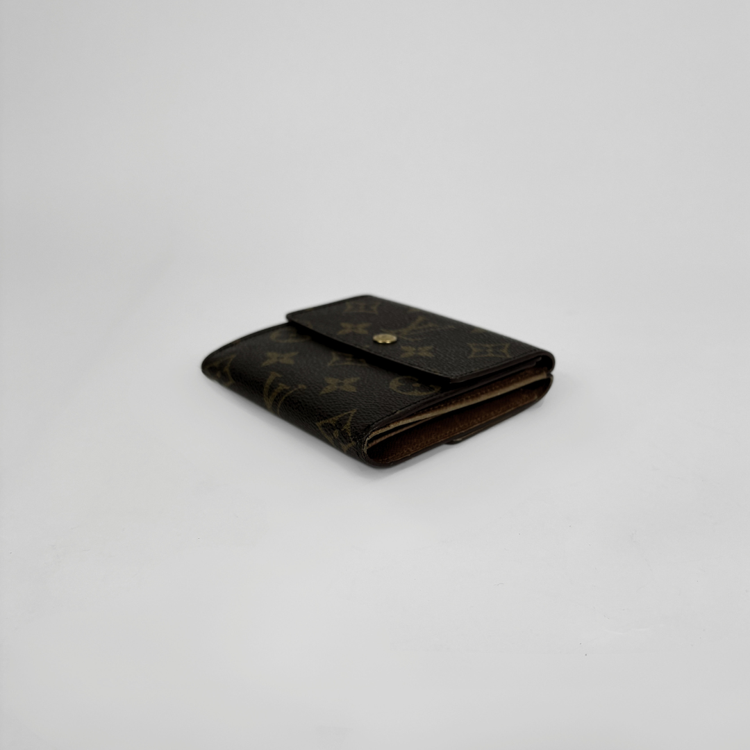 Louis Vuitton Druk Wallet on a white background