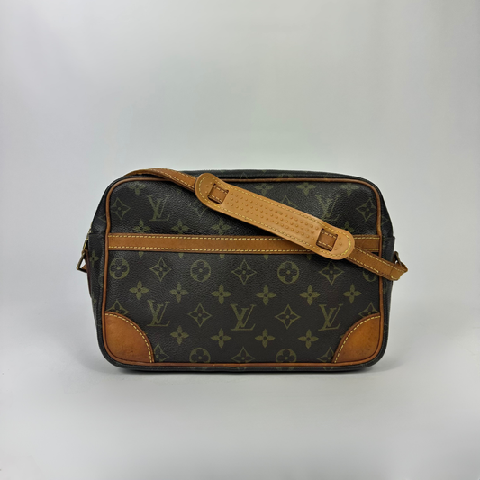 Brown handbag with gold monogram pattern 