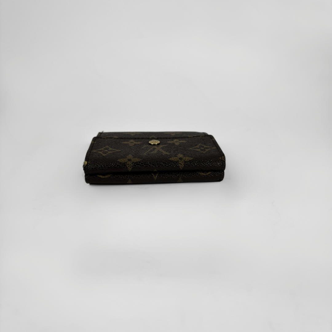 Louis Vuitton Druk Wallet on a white background