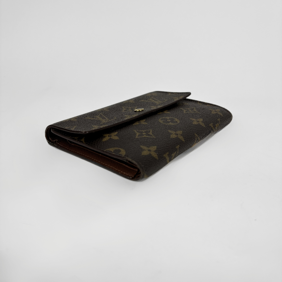 Louis Vuitton International Wallet Medium on a white background