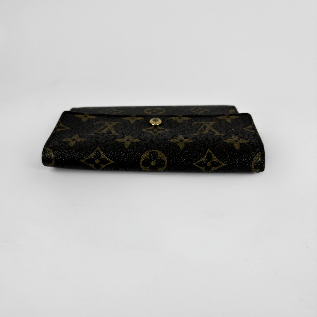 Louis Vuitton International Wallet Medium on a white background