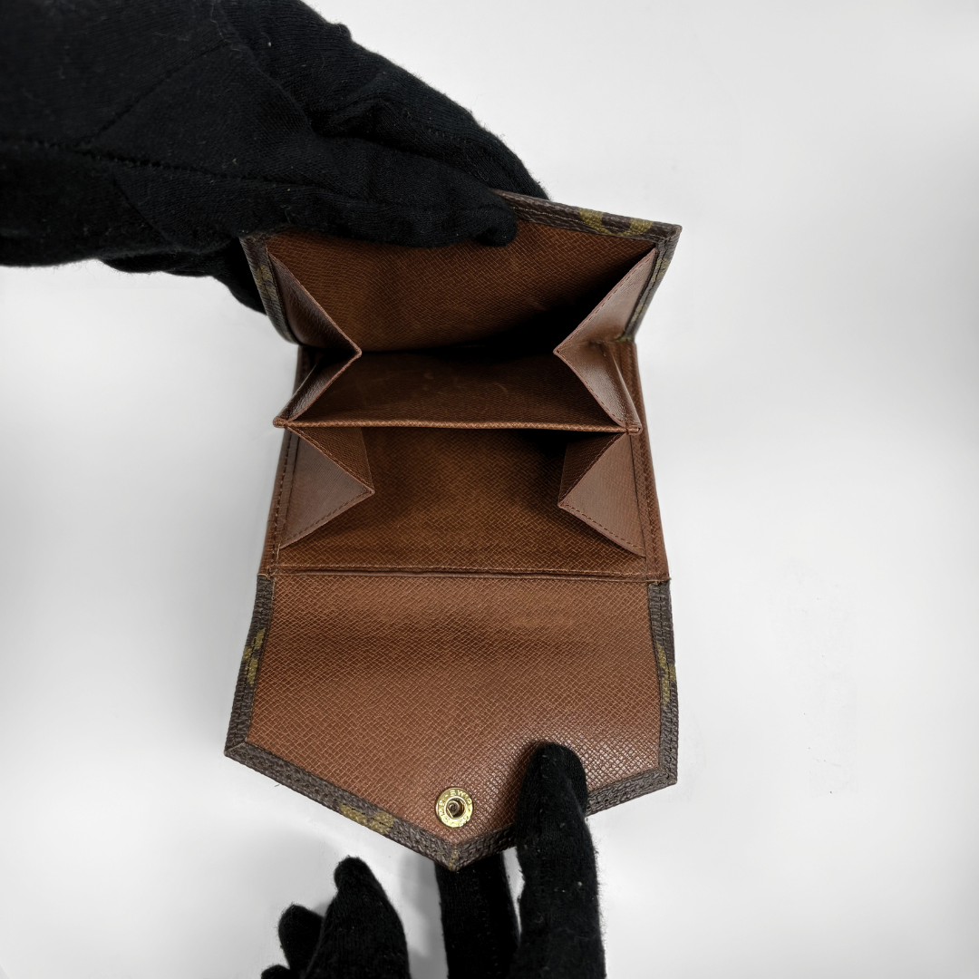 Louis Vuitton Druk Wallet on white background