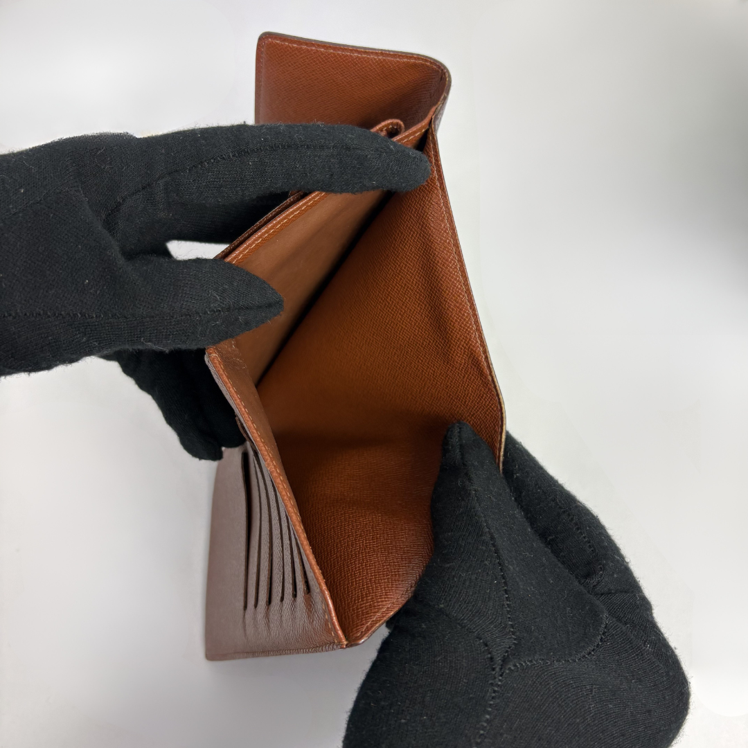 Louis Vuitton International Wallet Medium on a white background