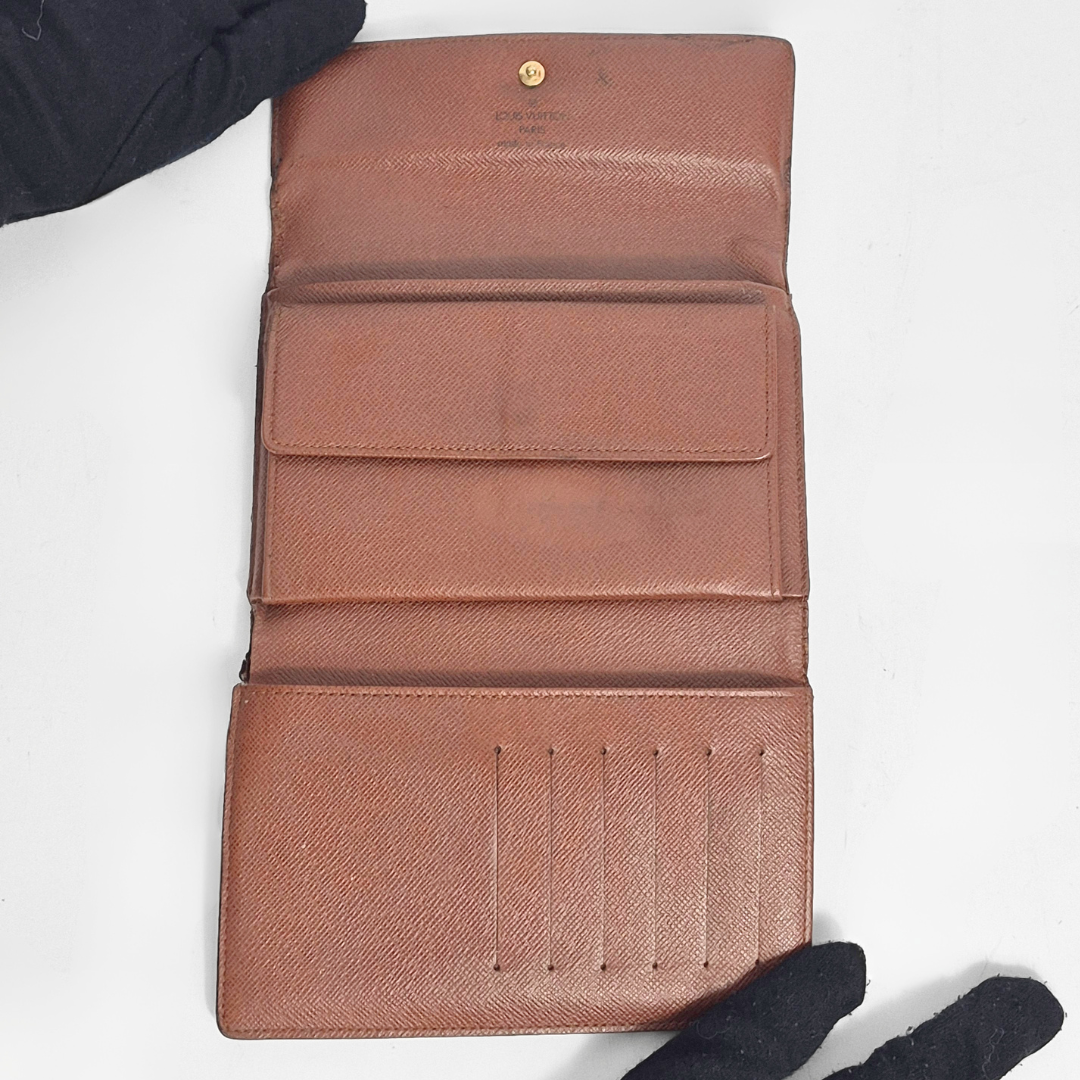 Brown leather wallet on a white background