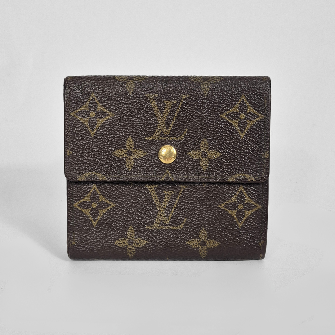 Louis Vuitton wallet with monogram pattern on a light gray background