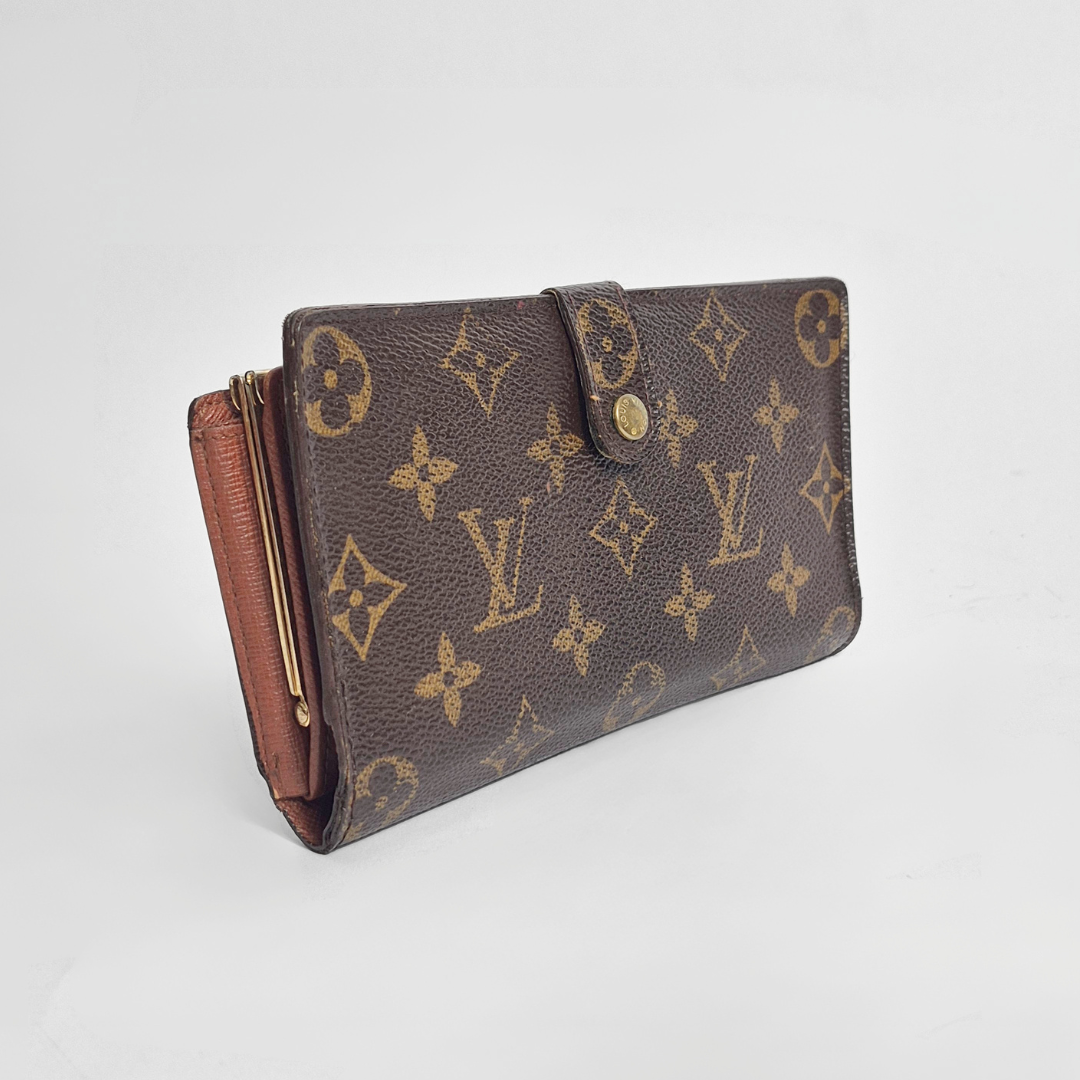 Louis Vuitton Cartera con estampado de monogramas sobre fondo gris claro