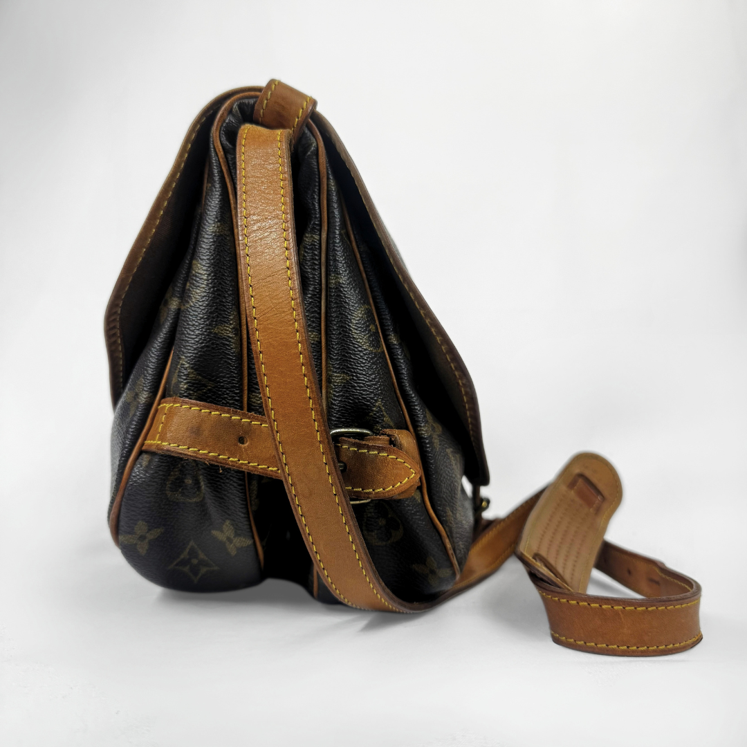 A Louis Vuitton shoulder bag in brown monogram canvas with tan leather straps and trim, shown on a clean white background.