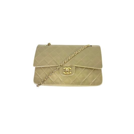 Lot - Chanel: a vintage metallic gold quilted mini flap bag 5 x 7 x 2in (13  x 18 x cm); strap drop 20in (51cm)