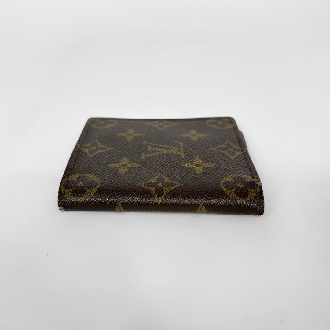 Louis Vuitton wallet with monogram pattern on a white background