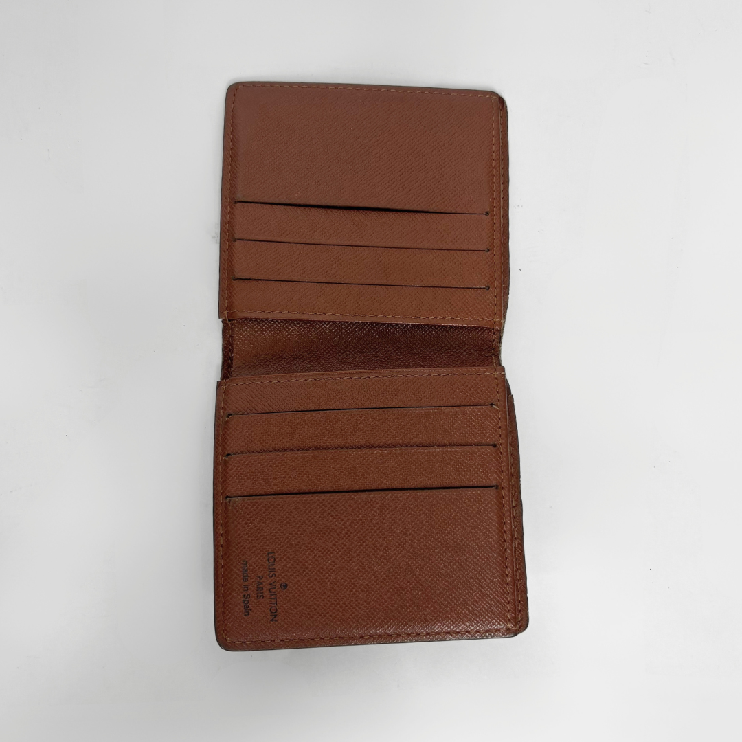 Brown leather wallet open on a white background