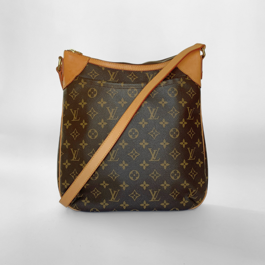 Designer handbag with monogram pattern on a white background