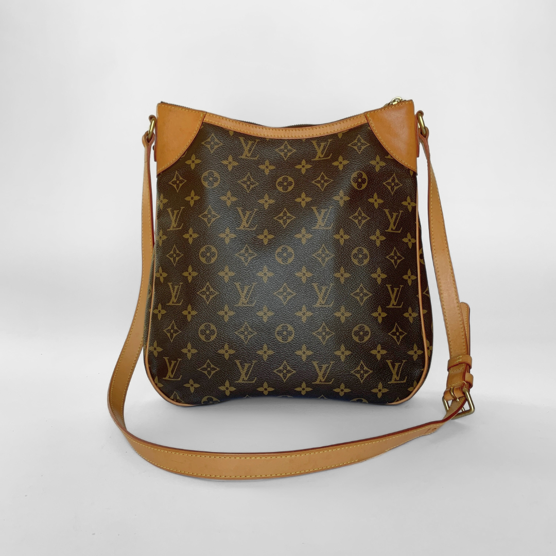 Designer handbag with monogram pattern on a white background