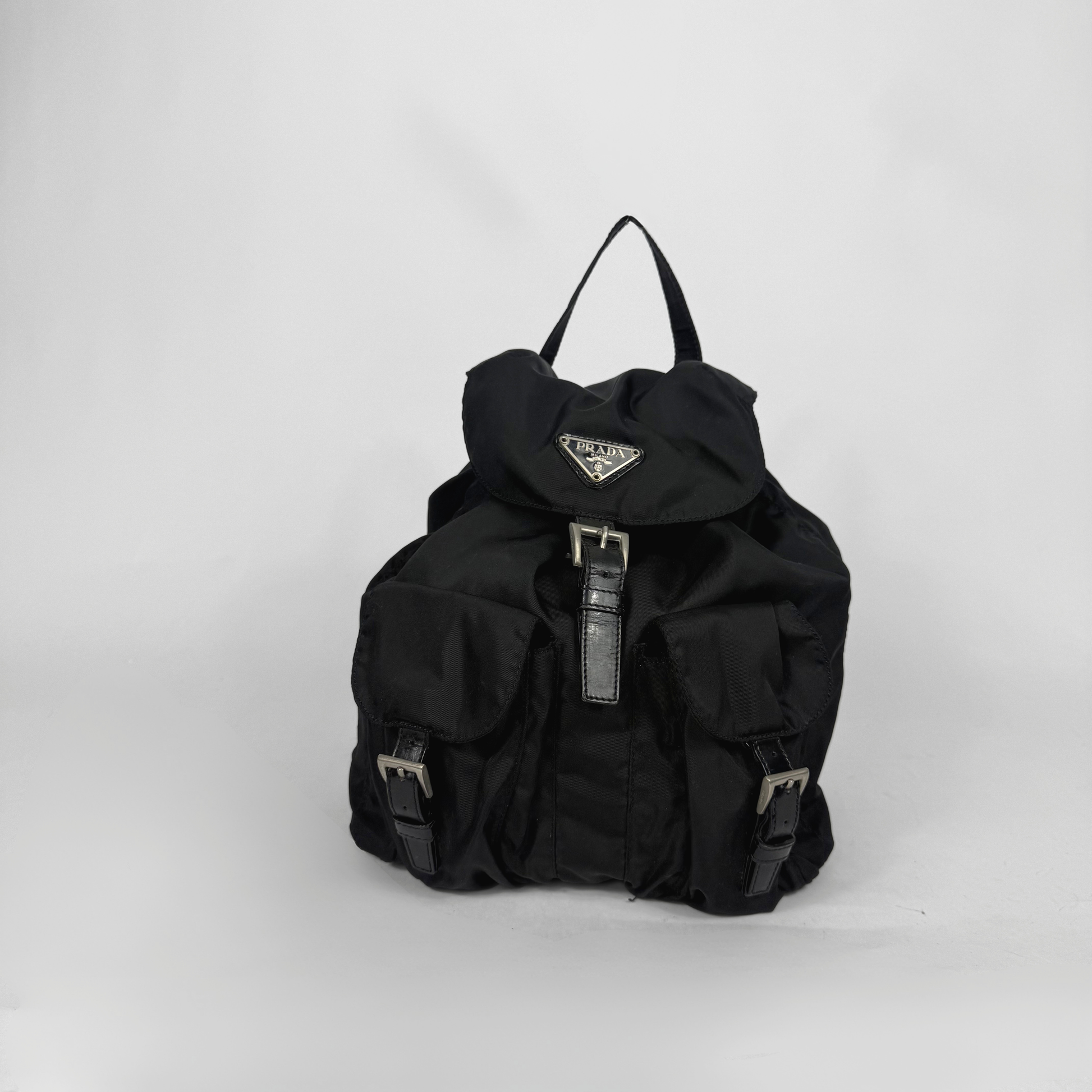 Black backpack with a brand logo on a white background