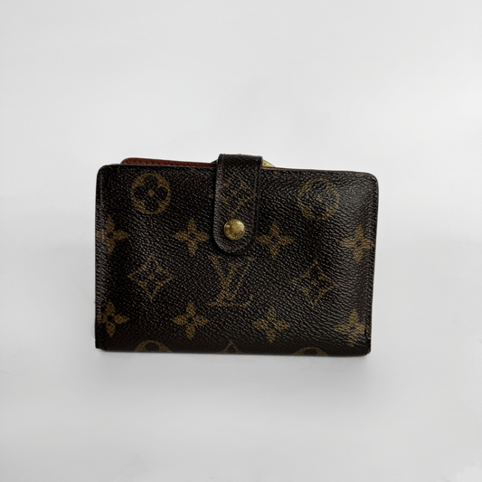 A Louis Vuitton monogram canvas wallet in dark brown with gold-tone hardware, photographed on a light gray background.