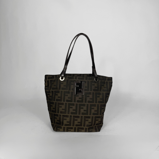 Black patterned handbag on a light gray background
