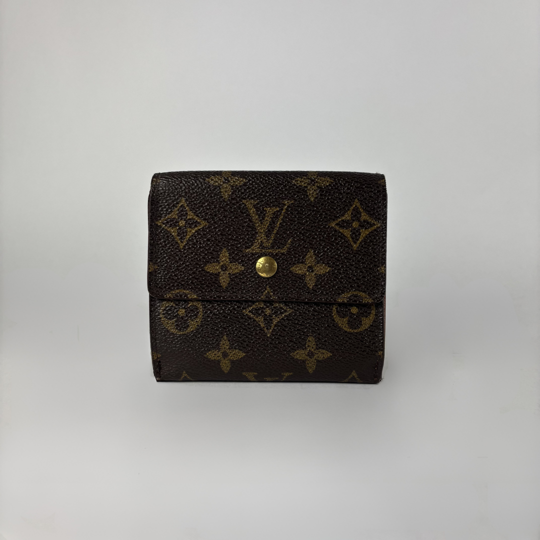 A Louis Vuitton monogram canvas bi-fold wallet in dark brown with gold-tone hardware, photographed against a neutral light gray background.