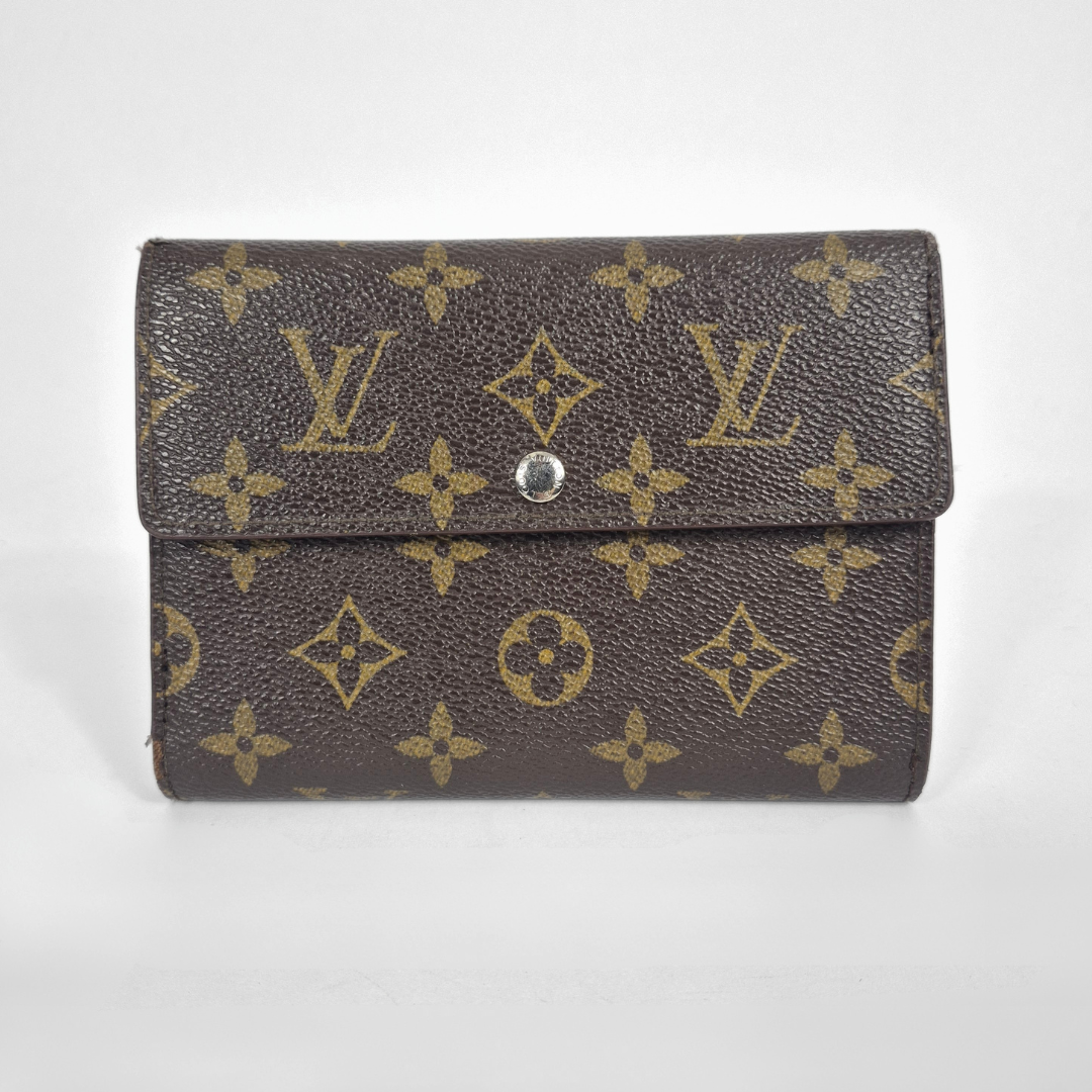 Louis Vuitton wallet with monogram pattern on a white background