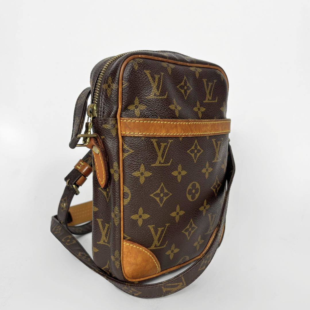 Brown Louis Vuitton bag with monogram pattern on a white background