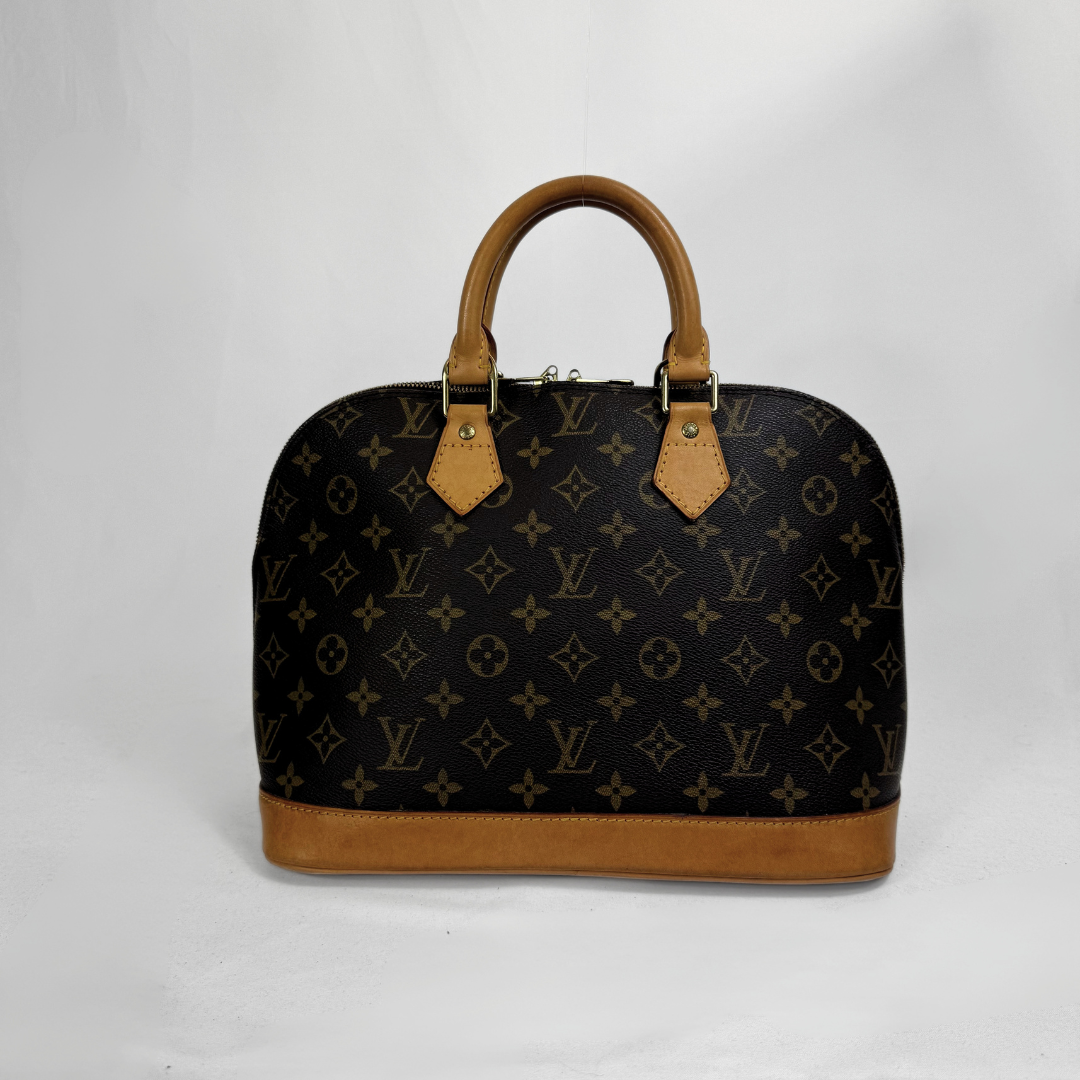 Louis Vuitton monogram canvas handbag with tan leather handles and base, photographed against a plain light background.