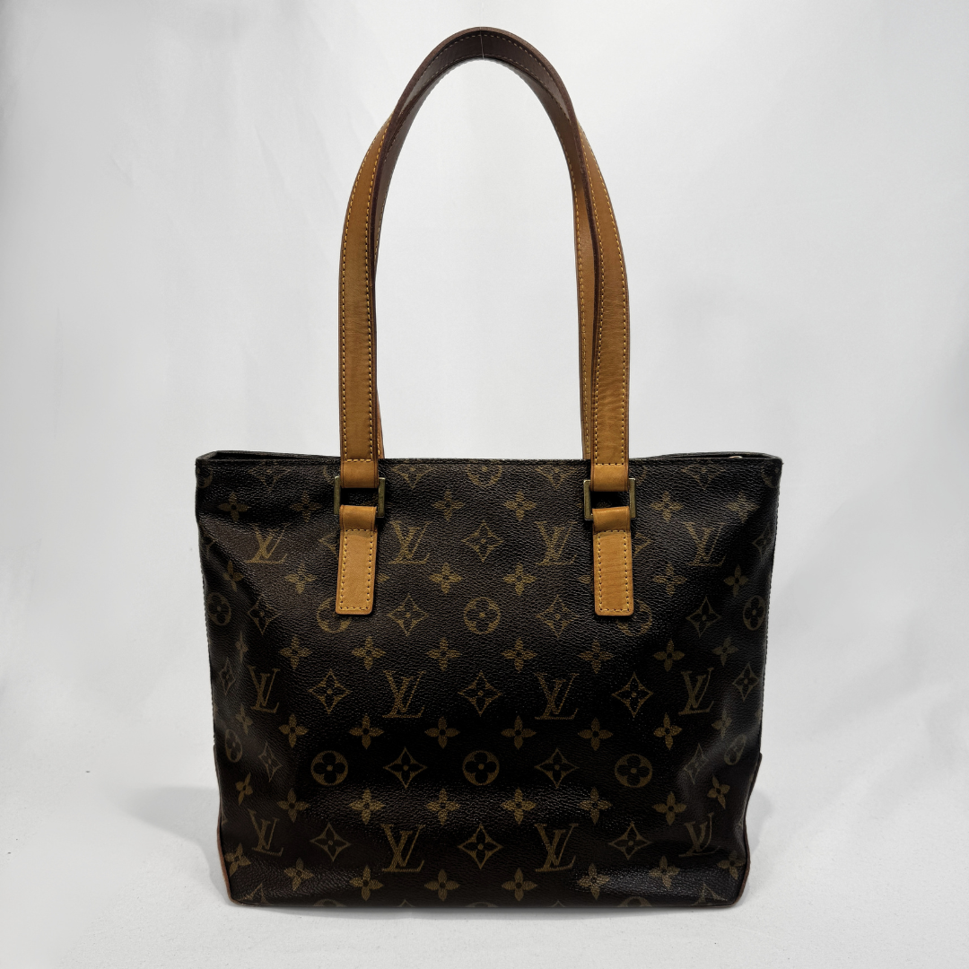 Louis Vuitton monogram canvas tote bag with tan leather shoulder straps, photographed against a plain white background.