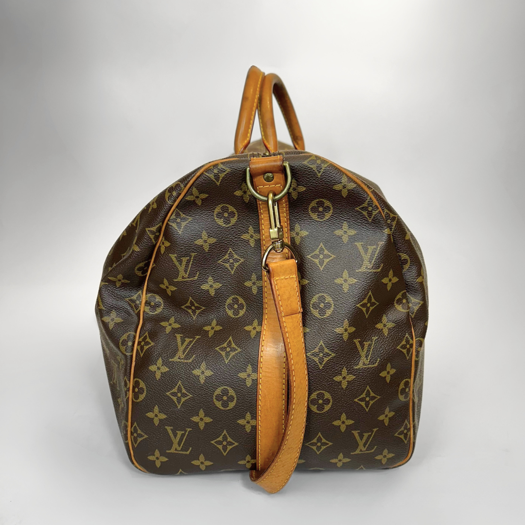 Brown Louis Vuitton bag with monogram pattern on a white background