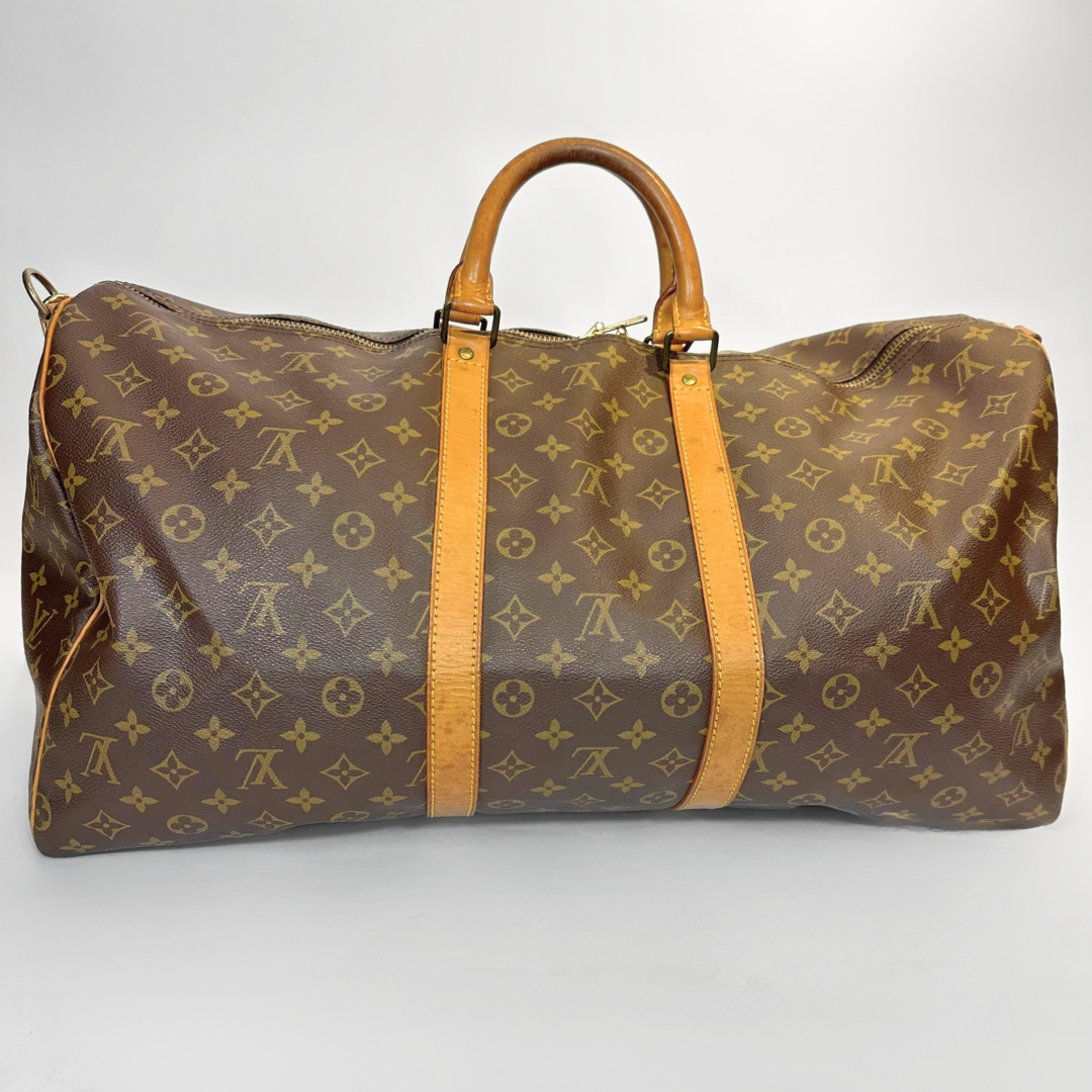 Brown travel bag with yellow accents on a white background
