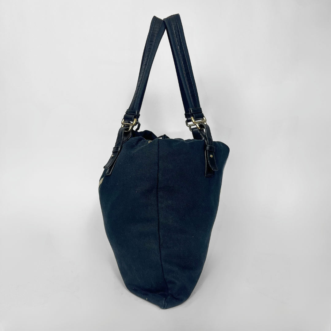 Navy blue handbag with a white logo on a white background