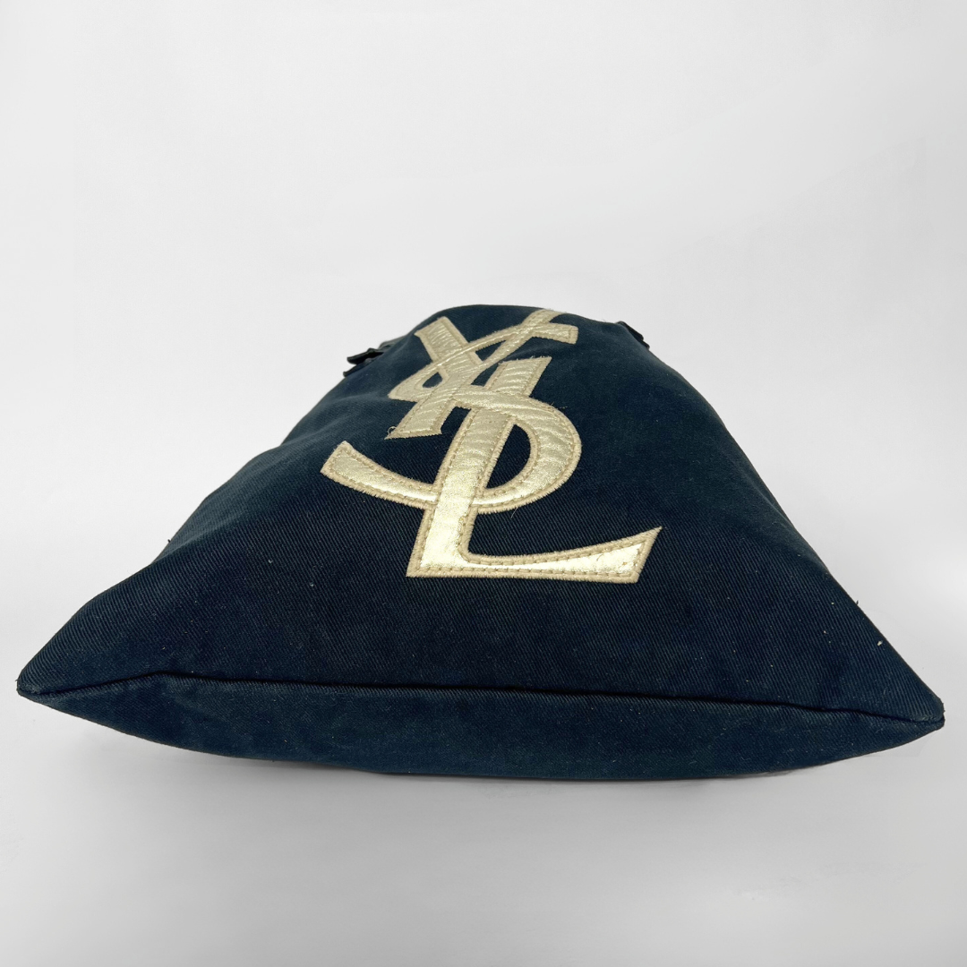 Navy blue handbag with a white logo on a white background