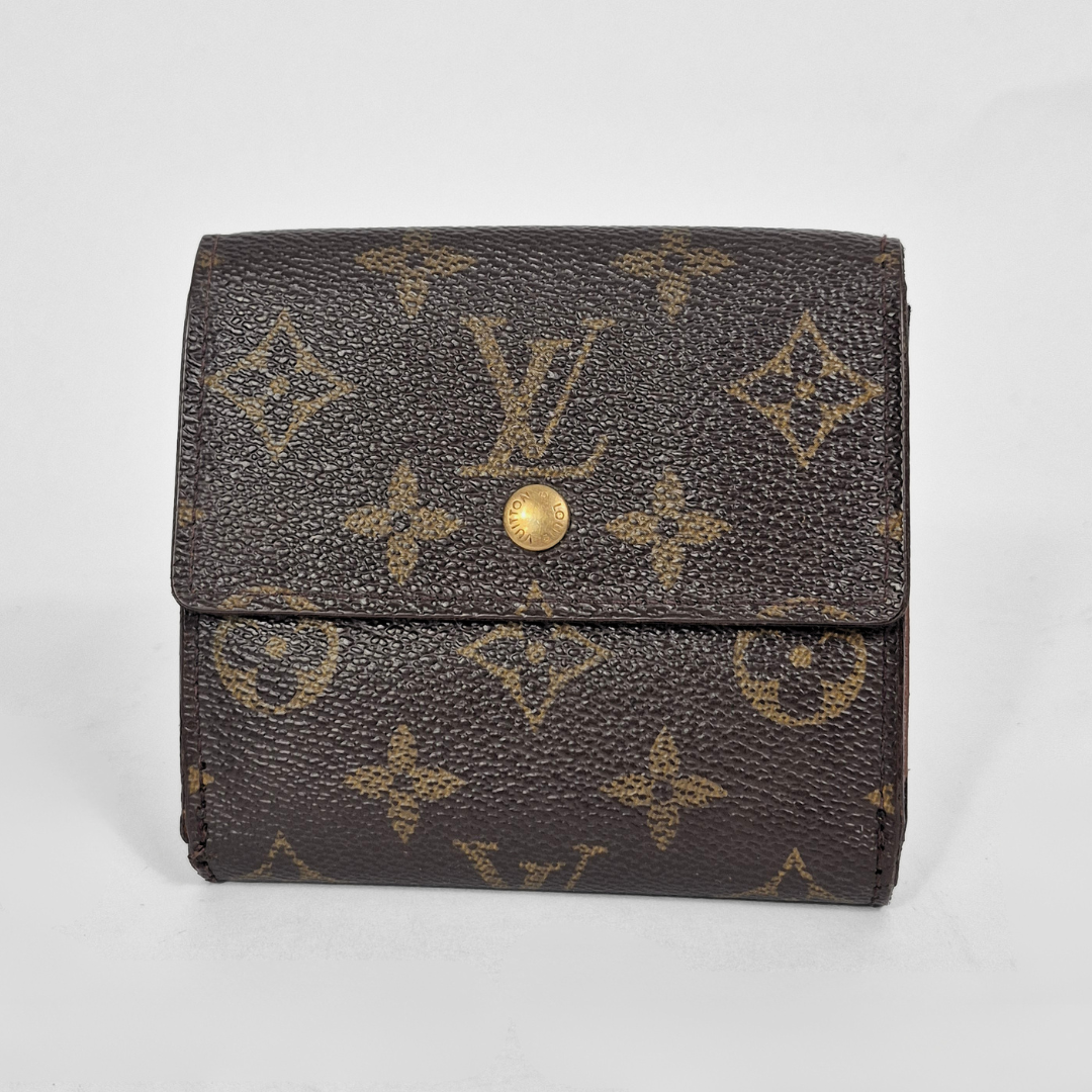 Louis Vuitton wallet with monogram pattern on a light gray background