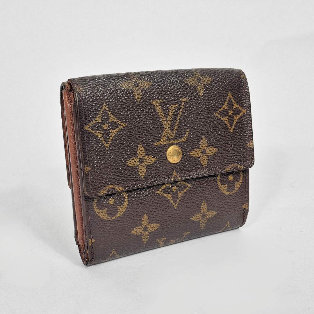 Brown wallet with gold monogram pattern on a white background