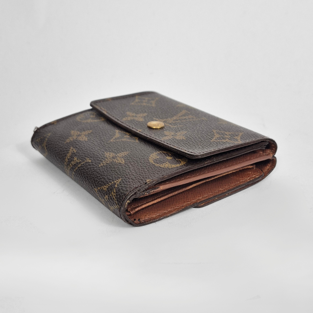 Brown leather wallet with visible brand logo on a light gray background