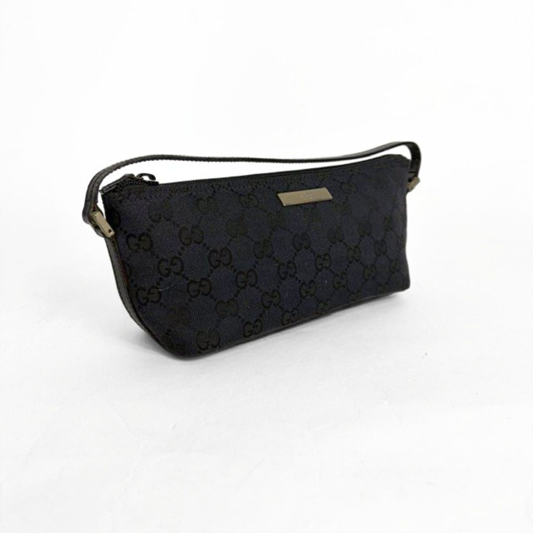 Black patterned handbag on a white background