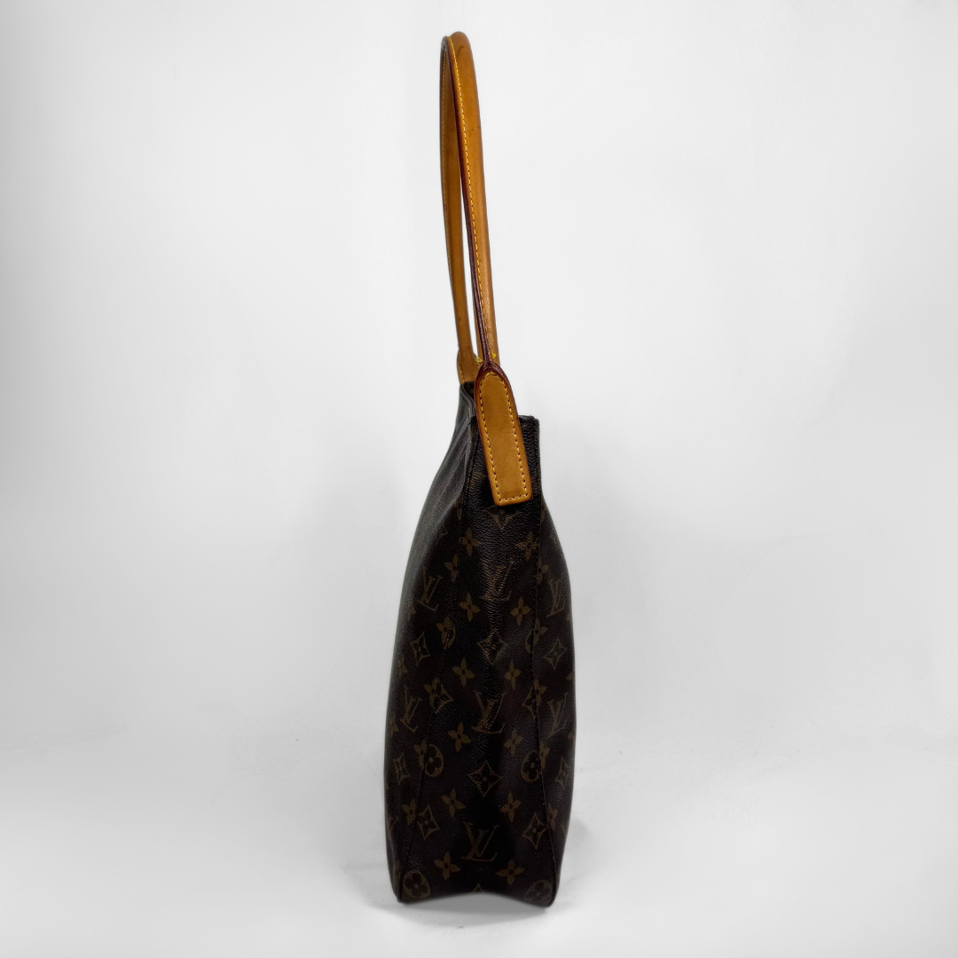 Louis Vuitton monogram canvas shoulder bag in dark brown with tan leather trim and handle, shown from a side profile view against a light gray background.