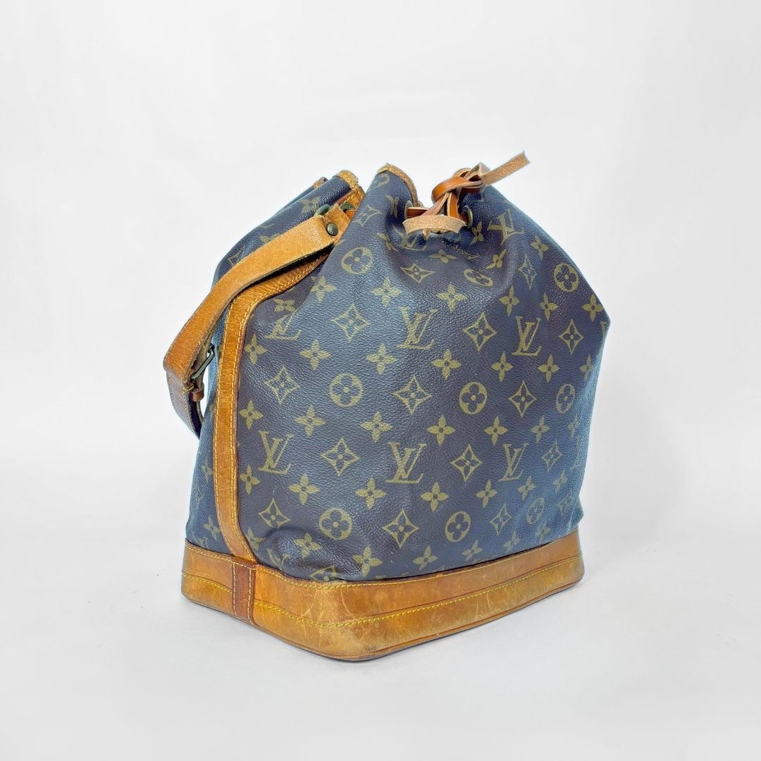 Brown monogram LV handbag with tan leather accents on a white background