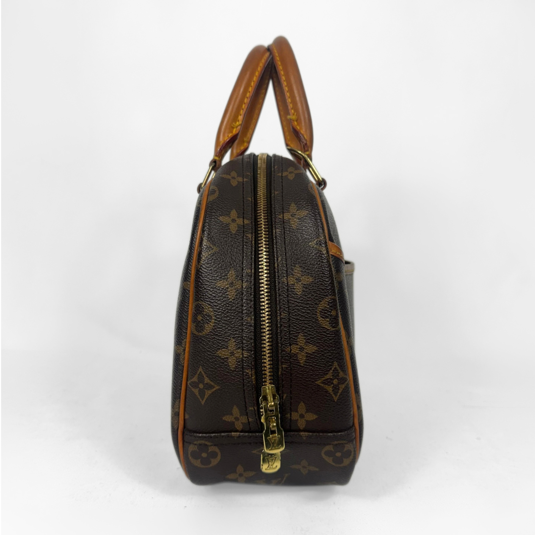 Louis Vuitton monogram canvas satchel with tan leather handles and gold-tone hardware, shown from the side on a white background.